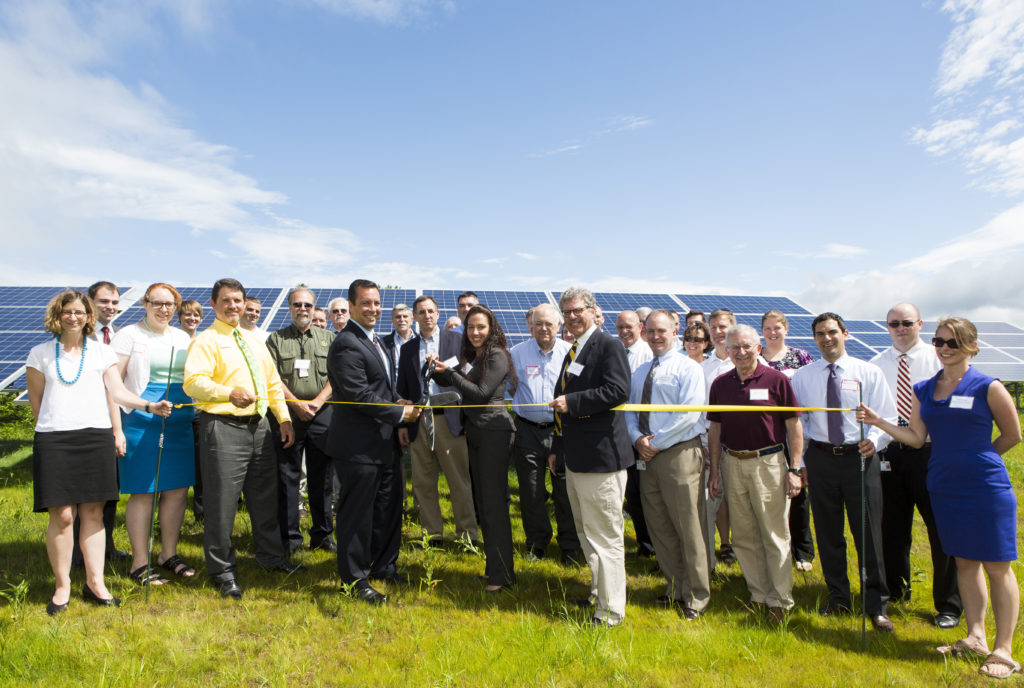 June 26, 2014. Gardner, MA. BCC CELEBRATES COMPLETION OF MILL STREET SOLAR PROJECT GARDNER, MASS. - Boston Community Capital announced completion of a 3,287-panel, one megawatt ground mounted solar array that will offset energy costs at local organizations at a ribbon cutting held today in Gardner. Developed in conjunction with the City of Gardner and the Gardner Redevelopment Authority, the Mill Street solar project is the first project completed as part of the Mill Street Urban Renewal Plan and is located on a remediated brownfield site owned by the Gardner Redevelopment Authority (GRA). The solar project utilizes Massachusetts’ pioneering net metering program to offset as much as 80% of the electricity use at a local nonprofit organization, two affordable housing developments and a local business, saving them 17% at today’s electricity prices and fixing their electricity costs for the next 10 years. © 2014 Marilyn Humphries